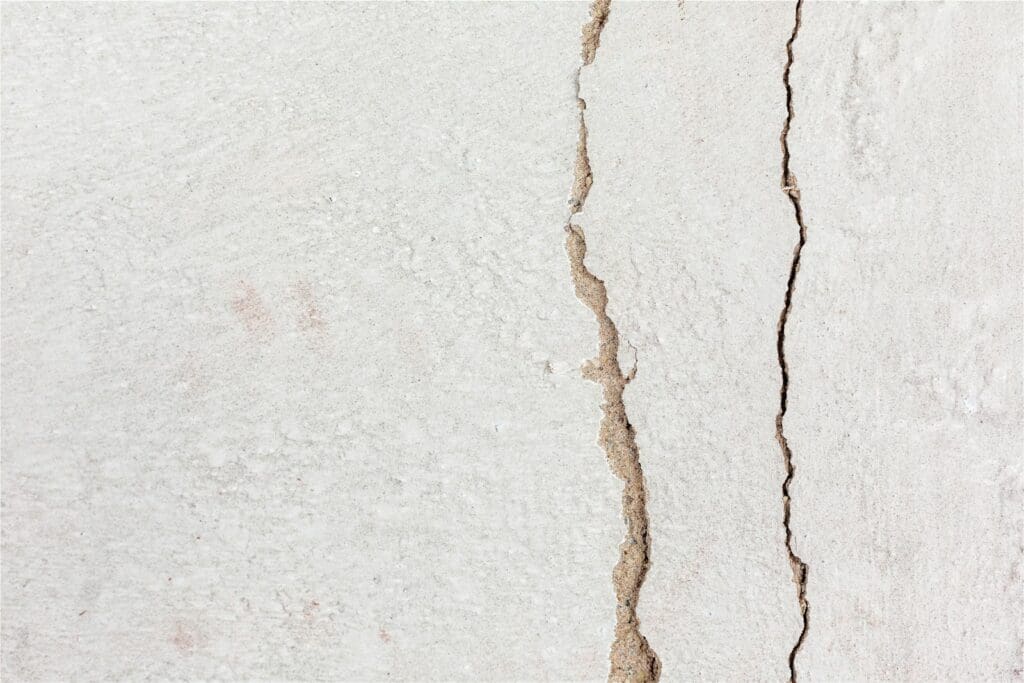 a crack in the side of a white wall