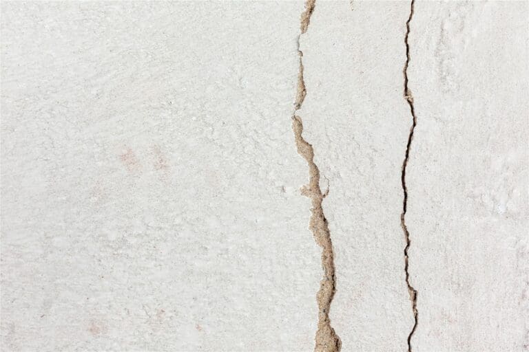 a crack in the side of a white wall